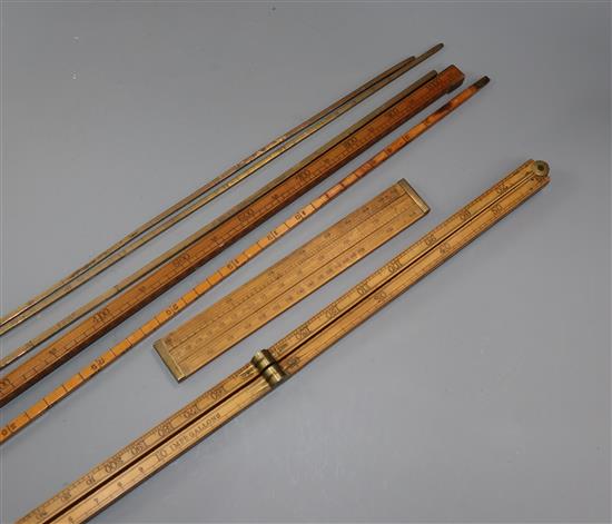 A collection of barrel dip sticks and rulers/measures
